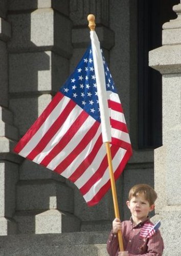 Ben at Feb teaparty holding the flag