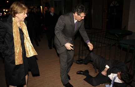 Associated Press photoA supporter of U.S. Senate candidate Democrat Martha Coakley helps journalist John McCormack of The Weekly Standard as Coakley looks on as she was leaving a fundraiser in Washington, Tuesday night.