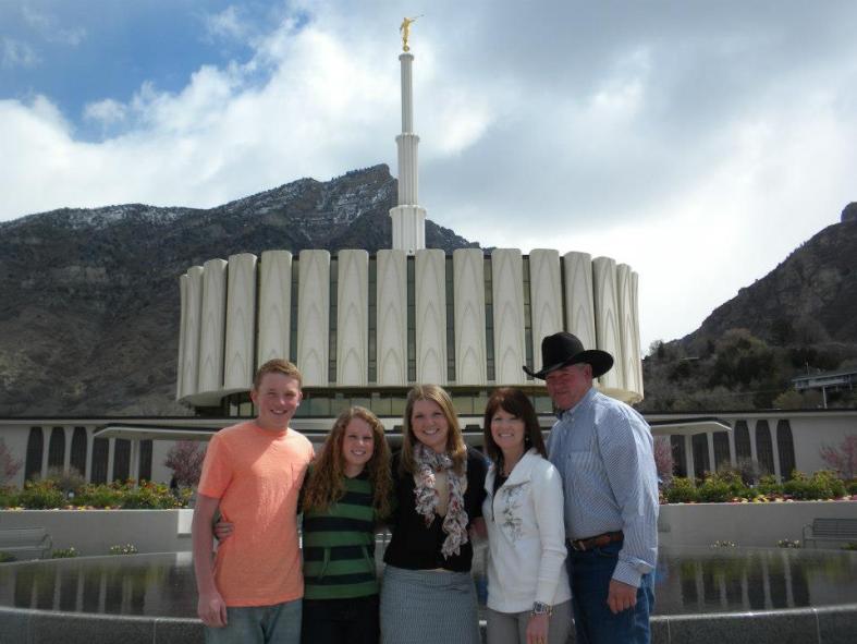 Shayla with the family in front of the temple